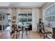 Bright breakfast nook with glass table and access to backyard patio at 10426 48Th E Ct, Parrish, FL 34219
