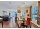Dining area with glass-top table and chairs overlooking the living room at 10426 48Th E Ct, Parrish, FL 34219