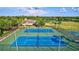 Two tennis courts and a basketball court in community at 10426 48Th E Ct, Parrish, FL 34219