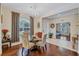 Bright dining room with glass table, four chairs, and hardwood floors at 10426 48Th E Ct, Parrish, FL 34219