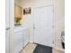Laundry room with washer, dryer, and storage cabinets at 10426 48Th E Ct, Parrish, FL 34219