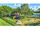 Community playground with play structures and picnic tables at 10426 48Th E Ct, Parrish, FL 34219