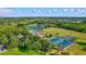 Aerial view of community amenities including tennis and basketball courts at 10426 48Th E Ct, Parrish, FL 34219