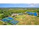Aerial view showing community pool, tennis, and basketball courts at 10426 48Th E Ct, Parrish, FL 34219