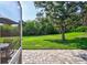 Spacious backyard with grassy lawn and paver patio at 10426 48Th E Ct, Parrish, FL 34219