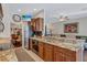 Kitchen boasts granite countertops, stainless steel appliances, and wood cabinets at 10426 48Th E Ct, Parrish, FL 34219