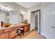 Double vanity bathroom with large mirror and separate toilet area at 10426 48Th E Ct, Parrish, FL 34219