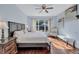 King-size bed, wood floors, and backyard view from window at 10426 48Th E Ct, Parrish, FL 34219