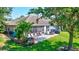 Aerial view of backyard with patio and lush landscaping at 10426 48Th E Ct, Parrish, FL 34219