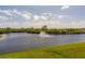 Serene lake with lush landscaping and a central fountain at 17B Franklin S Ct, St Petersburg, FL 33711