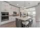 Modern kitchen with white cabinets and large island at 17B Franklin S Ct, St Petersburg, FL 33711