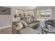Open living room and kitchen with island and water views at 17B Franklin S Ct, St Petersburg, FL 33711