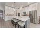 Modern kitchen with white cabinets, a large island and stainless steel appliances at 17B Franklin S Ct, St Petersburg, FL 33711