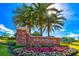 Brick community entrance sign with landscaping at 150 Belleview Blvd # 704, Belleair, FL 33756