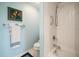 Updated bathroom with a shower/tub combo and light blue walls at 150 Belleview Blvd # 704, Belleair, FL 33756