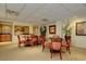 Well-appointed common area with tables and chairs, ideal for residents' gatherings at 150 Belleview Blvd # 704, Belleair, FL 33756