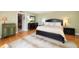 Large main bedroom with a king-size bed and walk-in closet at 150 Belleview Blvd # 704, Belleair, FL 33756