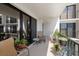 Relaxing balcony with patio furniture and plants, offering a peaceful outdoor space at 150 Belleview Blvd # 704, Belleair, FL 33756