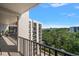 Peaceful balcony with scenic views of lush greenery and the bay at 150 Belleview Blvd # 704, Belleair, FL 33756