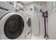 Convenient laundry area with washer, dryer, and storage at 150 Belleview Blvd # 704, Belleair, FL 33756