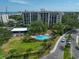 Aerial view showing condo building and pool at 150 Belleview Blvd # 704, Belleair, FL 33756
