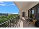 Spacious balcony overlooking treetops and buildings at 150 Belleview Blvd # 704, Belleair, FL 33756