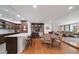 Bright dining area with hardwood floors and view into the living room at 150 Belleview Blvd # 704, Belleair, FL 33756