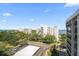 Aerial view showing the complex and surrounding landscape with water access at 150 Belleview Blvd # 704, Belleair, FL 33756