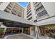 Modern condo building exterior with covered entryway at 150 Belleview Blvd # 704, Belleair, FL 33756