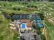 Aerial view of tennis courts, pool, and clubhouse at 150 Belleview Blvd # 704, Belleair, FL 33756