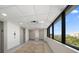 Bright hallway with elevator access and stunning water views at 150 Belleview Blvd # 704, Belleair, FL 33756