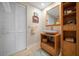 Guest bathroom with a floating vanity and built-in shelving at 150 Belleview Blvd # 704, Belleair, FL 33756