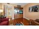 Common area with built-in shelving and hardwood floors at 150 Belleview Blvd # 704, Belleair, FL 33756