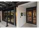 Modern building entrance with secure access and parking area at 150 Belleview Blvd # 704, Belleair, FL 33756