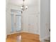 Bright entryway with hardwood floors, chandelier, and access to other rooms at 2848 Bayshore Trails Dr, Tampa, FL 33611