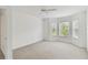 Bright bedroom with bay window and ceiling fan at 2848 Bayshore Trails Dr, Tampa, FL 33611
