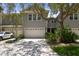 Two-story house with attached garage and manicured landscaping at 2848 Bayshore Trails Dr, Tampa, FL 33611