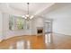 Spacious dining room with hardwood floors, fireplace, and large windows at 2848 Bayshore Trails Dr, Tampa, FL 33611