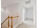 Upper level hallway with carpeted floors and wooden railings at 2848 Bayshore Trails Dr, Tampa, FL 33611
