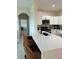 Modern kitchen with white cabinets and quartz countertop at 2746 Via Tivoli # 132B, Clearwater, FL 33764