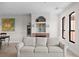 Living room with a beige sofa and fireplace at 2746 Via Tivoli # 132B, Clearwater, FL 33764