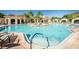 Resort-style pool with lounge chairs and shaded areas at 2746 Via Tivoli # 132B, Clearwater, FL 33764