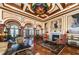 Upscale lobby with high ceilings, artwork, and comfortable furniture at 2746 Via Tivoli # 132B, Clearwater, FL 33764