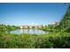 Tranquil lakefront view of community buildings at 2746 Via Tivoli # 132B, Clearwater, FL 33764