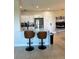 Modern kitchen with breakfast bar and white cabinets at 2746 Via Tivoli # 132B, Clearwater, FL 33764