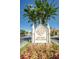 Grand Bellagio community entrance sign with landscaping at 2746 Via Tivoli # 132B, Clearwater, FL 33764