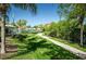 Pathway through lush landscaping, near community amenities at 2746 Via Tivoli # 132B, Clearwater, FL 33764