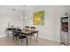 Dining area with wooden table and four chairs at 2746 Via Tivoli # 132B, Clearwater, FL 33764
