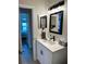 Clean bathroom with a single vanity and updated fixtures at 2746 Via Tivoli # 132B, Clearwater, FL 33764