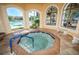Relaxing hot tub with seating and views of the pool area at 2746 Via Tivoli # 132B, Clearwater, FL 33764
